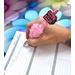 Photo of Mauve-pink pen in use. Has a focal bead that says "Small Business Babe".
