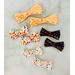 3 different 2" ribbon hair bows; colorful dots, black ABC's & apples, & colorful numbers. Also come in 3" sizes. 