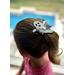 My year old daughter modeling the white and black ghost shaped hair bow, with spider web printed design on top. Bow is approx. 3 x 3.