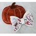 Off white glitter and faux leather print Halloween cowgirl western design hair bow. Bow is sold individually.