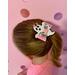 My 4 year old daughter modeling the white & black ghost shaped bow, w/ pink glitter spider web design. Ghost is wearing tiny pink bow. 