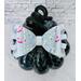 Another close up view of soft lavender glitter ribbon & faux leather hair bow. Bow is sold individually.