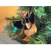 German Shepherd Ornament in Brown with Black, hanging in a Christmas Tree.