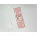 this laminated bookmark is on a white table with fairy lights on the left side of the book placeholder