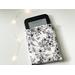 an ebook peeking out of the floral ebook covers