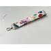 a side angle of the floral lanyard wristlet