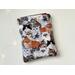 this cat book sleeve is covered in cats