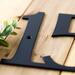 Close up of matte black powder coat on our metal address sign.