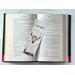 the country book placeholder is in the middle of an open book with fairy lights above