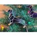 Close up of Dachshund Ornament- black and tan- hanging in Christmas Tree.