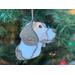 Close up of Beagle ornament hanging in a Christmas tree.