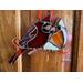 Cardinal Ornament hanging on a wall.