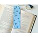this floral bookmark with blue background with blue flowers all over the page holder