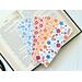 this floral bookmark set comes with four laminated bookmarks
