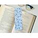 blue bookmark light blue background with different shades of blue flowers, leaves, and polka dots
