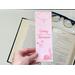 the words. Underneath the word Romance there is a pink outline of a running horse. above the word Cowboy between the boarders in a pink outline of a bull. The book mark is laminated