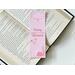 this cowboy romance bookmark has a pink background with a little bit of a darker pink boarder on top and bottom left. there is a cactus in the bottom right. In the middle of the bookmark there are words Cowboy Romance with a cute design between