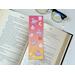 This witch bookmark has witches hats, brooms, bats, moons. all over the book mark