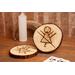 two wooden engraved coasters on coffee table with rune symbol inspired by yellowjackets television show, tv show prop