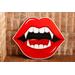 red vampire lips with fangs artwork wall hanging on wood, horror room decoration with gothic home aesthetic