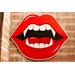 red vampire lips with fangs artwork wall hanging on wood, horror room decoration with gothic home aesthetic