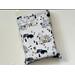 this book sleeve has a light gray background with mountains, bulls, trees, words like 'adventure, explore, roam wild.' all over the book holder
