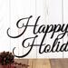 Close up of our happy holidays script metal wall decor, in matte black powder coat.