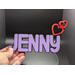 Base Black.  Top Lettering Color Lavender.  Emoji Hearts in Red