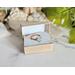 Emerald Leaf Copper Ring in packaging