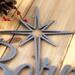 Close up of silver vein powder coat on our Unto Us a Savior is Born metal sign.