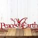 Christmas peace on earth metal wall art with peace dove silhouette, in red powder coat.