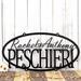 Oval family first names and last name metal plaque, in matte black powder coat. 