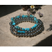 western look bracelets. 3 in a stack, sold as one. metal beads ns turquoise blue stone. stretchy.