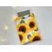 a ereader is peeking out of the flower cover