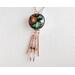 Dichroic glass pendant: metallic hues of copper, green, red with copper seed beads on wire dangle from the bottom of pendant on copper chain