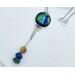 Dichroic glass: metallic blue, green, yellow hues. Lapis, malachite, and gold tiger eye beads dangle on chain from bottom. Silver chain