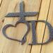 Close up of silver vein powder coat on our personalized name sign with cross and heart.
