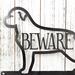 Close up of Rottweiler dog silhouette on our Rottweiler metal wall art, in raw steel.