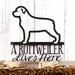 A Rottweiler Lives Here metal sign, in matte black powder coat.