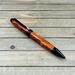 amber looking pen