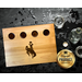 12X9-in. maple hardwood shot glass flight board featuring the Wyoming Cowboy logo in brown and gold resin. Perfect for bars, gifts, decor!