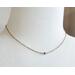necklace - one small blue round crystal bead on a gold chain