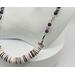 necklace with 1/2" in diameter white and purple shell button style beads, smaller faceted charoite gemstones, and a stainless steel chain 