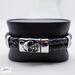Braided Leather Bands adorned with a spooky skull clasp - Jon B Leather