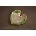 6x6" heart shaped plate with Hosta plant texture. Glazed with a dark green rim and a mixture of blue and grey throughout the middle. 