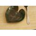 6x6" heart shaped plate with Hosta plant texture. Glazed with a dark green rim and a mixture of blue and grey throughout the middle. 