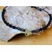single bracelet metallic aurora color heart charm flanked by glass beads