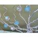 branch detail, beads are delicately wrapped into the aluminum wire