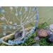 side view of blue beaded wired tree of life sky blue color beads, crystal facet beads shimmer in the sunlight