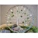 front of tree of life. branches ae made carefully by twisting and turning aluminum wire. decorated with green crackle glass beads